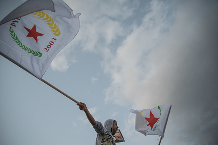A demonstrators seen displaying a flags during a protest in front of Greek University.

A rally took place at Athens' Propylaea, followed by a tour to the Turkish Embassy in Athens. The protest is against the Turkish state, which went through a total attack against the Kurds. In Afrin, villages are being destroyed and inhabited areas are being ravaged. Children and women are murdered with heavy bombardments.