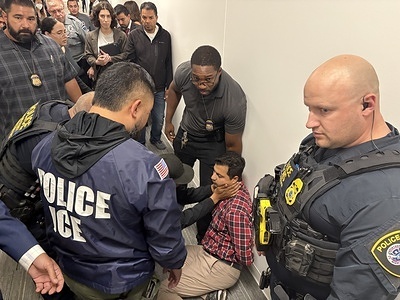 A man doesn't feel well when ICE attempted to arrest him. U.S. Immigration and Customs Enforcement (ICE) conducted multiple arrests outside the immigration court in San Diego, detaining at least five individuals. Some were handcuffed immediately in the courthouse hallway, drawing concern from witnesses. At least one person appeared to suffer a medical issue during the attempted arrest, prompting further alarm among onlookers.