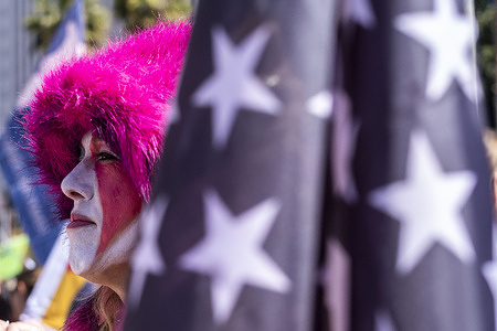 A protester with face painting takes to the streets of downtown Los Angeles for the Women's March, in Los Angeles.