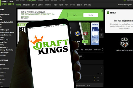 In this photo illustration, the Draft kings online betting app logo is seen displayed on a smartphone screen.