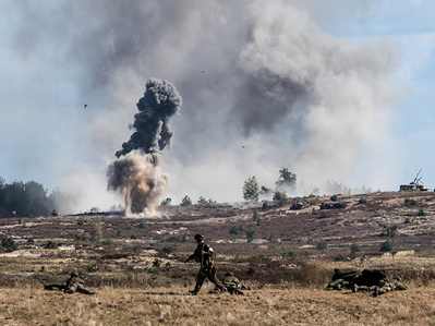 Explosions seen as Polish infantry soldiers of the Territorial Defense Forces train live-fire under cover escape during the Iron Defender 25 media day. The Iron Defender 25 exercise is the largest and most significant training event planned by and for the Polish Armed Forces. It is a series of defensive exercises conducted on land, in the air and on water by the Land Forces, Air Force, Navy, Special Forces and Territorial Defense Forces. Thirty thousand soldiers and 600 pieces of equipment from the Polish Armed Forces and NATO allies are participating.