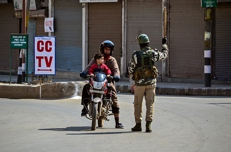 A paramilitary trooper seen stopping a motorcyclist during restrictions in old city of Srinagar, Kashmir.
A complete shutdown is being observed in the old city of Srinagar to protest against the National Investigation Agency (NIA) summon to the Kashmir's chief cleric and world renowned religious scholar Mirwaiz Umar Farooq for questioning in its ongoing probe into the terror funding case. Strict restrictions were imposed in the old city of Srinagar following the shutdown call given by the Srinagar-based Traders Coordination Committee.