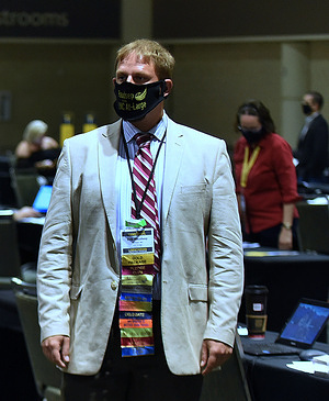 Erik Raudsep, a North Carolina delegate, is seen wearing a face mask at the 2020 Libertarian National Convention at the Orange County Convention Center.
Some attendees wore face coverings and practiced social distancing at the gathering. Florida reported over 15,000 new coronavirus cases, topping the U.S. record for a single day.