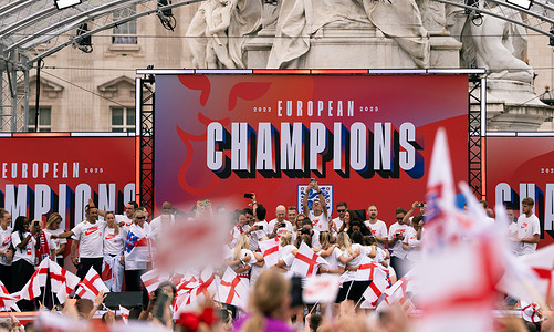Newly crowned UEFA Women's EURO 2025 champions, the England Women's National Team, celebrate their victory with a homecoming parade and stage ceremony at the Queen Victoria Memorial outside Buckingham Palace, greeting tens of thousands of fans that gathered to honor their triumph in London. England defeated Spain 3-1 on penalties in the UEFA Women's EURO 2025 Final to retain the trophy.