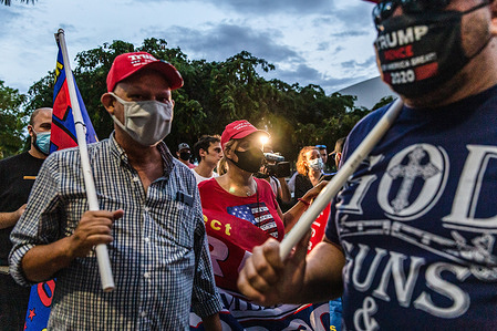 Supporters of President Donald Trump seen at a rally on Biscayne Boulevard close to the PAMM museum (Pérez Art Museum Miami).
Demonstrators both for and against President Trump gathered in downtown Miami tonight where the president held a town hall meeting with NBC News where the Presidential Debate was to be held before it was canceled. The president scheduled this town hall to compete with Joe Biden’s town hall with ABC news in Pennsylvania and their competing events took place in lieu of the canceled Presidential Debates.