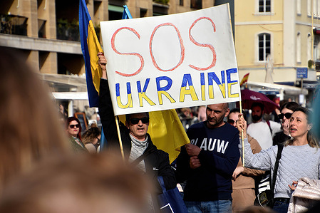 Protesters holding a banner while chanting slogans during the demonstration. Ukrainians living in France and their supporters gathered outside the town hall of Marseille to protest against the Russian invasion of Ukraine.