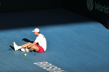 Maks Kaśnikowski seen injured during the Polish Davis Cup Team training at Pat Rafter Arena in preparation for the upcoming Davis Cup World Group I against Australia.