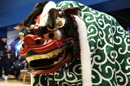 A rare shishimai (traditional Japanese lion dance) appears before shoppers at the Isetan Department Store. Shishimai or the traditional Japanese lion dance is a cultural performance believed to bring good luck, ward off evil spirits and pray for health and prosperity. The lion is thought to have the power to drive away bad fortune and during New Year celebrations it often “bites” people’s heads especially children which is believed to bring wisdom, protect against illness, and ensure a year of good health.