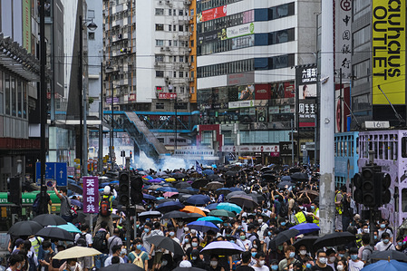 Riot police fire teargas to disperse the protesters during an anti-government rally. 
Beijing is pushing to implement tough new national security laws and anti-sedition law on the city's behalf and bypassing Hong Kong's legislature.
