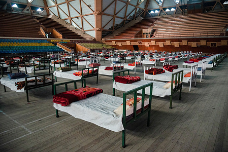 Beds are placed to set up a Covid-19 isolation centre inside an indoor sports stadium in Srinagar.The Jammu and Kashmir reported 3,164 positive cases, highest ever since the outbreak of Covid-19 pandemic last year, pushing the number of active cases to 22,283 which otherwise were less than 600 around a month before. A 20 year old woman was reported among the Twenty five deaths in J&K in the last 24 hours taking the death toll to 2,197.