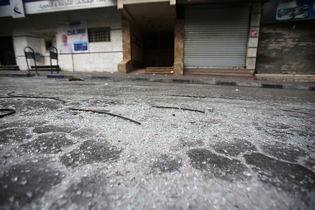 Broken Glasses seen in front of a building which was hit by an Israeli air strike in Gaza City. At least 15 people died and 140 were injured, including a child, in a series of Israeli airstrikes on multiple targets in the Gaza Strip including a residential apartment in the neighbourhood of Al-Rimal. Al-Quds Brigades, the armed wing of the Palestinian Islamic Jihad, announced that senior leader Tayseer al-Jabari was killed in the attacks.