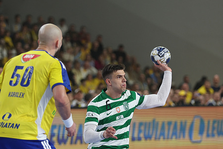 Artsem Karalek of Industria Kielce (L) and Francisco Mota Costa of Sporting (R) seen in action during the EHF Champions League 2025/2026 match between Industria Kielce and Sporting at Hall Legionow. Final Score; Industria Kielce 39:33 Sporting .