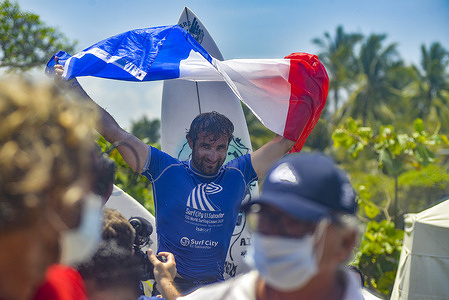French surfer Joan Duru celebrates after the men's finals.
El Salvador hosts the ISA World Surfing Games where the winners will be given tickets to the Tokyo Olympics.