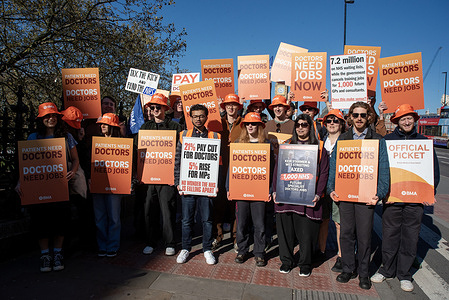 Resident doctors hold placards during the demonstration. British Medical Association (BMA) members were seen striking outside the St Thomas' Hospital in London. The resident doctors began their six days long strike for a higher pay rise because according to the BMA, the doctors are still being paid a fifth less than they were in 2008 once inflation is taken into account.