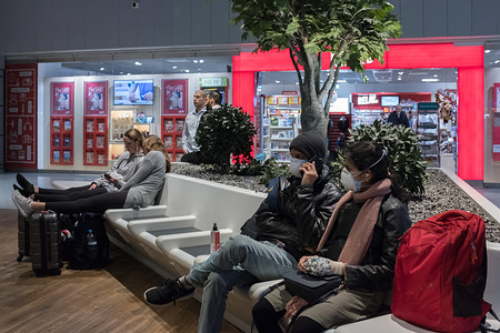 Travelers wear face masks as a precaution against the spread of Coronavirus at the Frankfurt Airport.
United States president Donald Trump imposed restrictions on arrivals from the European Schengen Area, in efforts to curb coronavirus spread in the US.