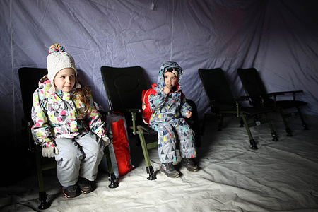 Ukrainian children sitting in a tent after arriving in Olkusz train station.
Over 700,000 Ukrainian people seek refuge in Poland as result of Russia's aggression on their country. Many of them come to Polish cities by train, where humanitarian help is organized for those in need.