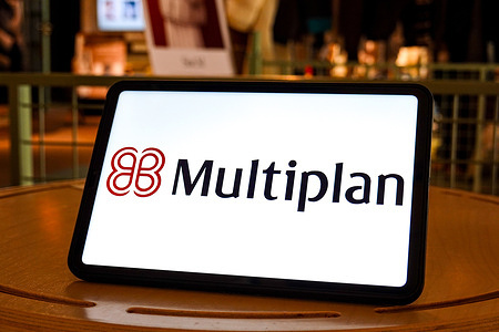 In this photo illustration, a Multiplan logo is seen displayed on the screen of a tablet.