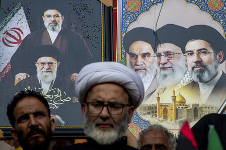 Kashmiri Shiite Muslim mourners hold frames depicting images of Iranian Supreme Leaders as they take part in a religious procession on the 12th day of the Islamic month of Muharram in the outskirts of Srinagaradministered Kashmir. Muharram, the first month of the Islamic calendar, is observed by Shiite Muslims around the world in remembrance of Imam Hussain, the grandson of the Prophet Muhammad, who was killed along with members of his family and companions in the Battle of Karbala in present day Iraq in 680 AD.