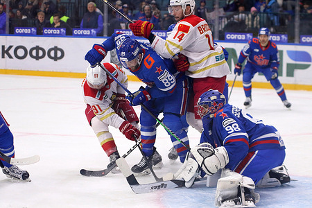 Kunlun Red Star Hockey Club player, Tyler Wong (91), Devin Brosseau (14) and SKA Hockey Club player, Nikita Serebryakov (98), Alexander Galchenyuk (89) seen in action during the Kontinental Hockey League, regular season KHL 2023 - 2024 between SKA Saint Petersburg and Kunlun Red Star Beijing at the Ice Sports Palace. 
(Final score; SKA Saint Petersburg 6:2 Kunlun Red Star Beijing)