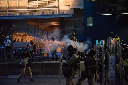 Riot police fire tear gas at protesters during a protest against the government.
Protesters took to the streets in yet another round of anti-extradition marches. Police fired dozens of rounds of tear gas and rubber bullets in clashes with protesters, while residents and bystanders were also caught in the crossfire at various locations.
Anti-government protesters continued their weekend marches despite government warnings labeling the protests as illegal. The Hong Kong government has yet to cave to any of the protesters demands, including the demand to fully withdrawal the controversial extradition bill.
