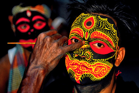 Hindu boy poses for picture as they attend and celebrate Bengal New Year festival called Gajan at west Bengal area. Gajan associated with gods as Shiva, Neel and Dharmathakur. It is spans around a week, starting at the last week of Choitro continuing till the end of the Bengali year. Participants of this festival are known as sannyasi or Bhokta. The central theme of this festival is deriving satisfaction through non-sexual pain, devotion and sacrifice.
