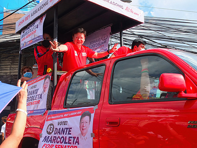 SAGIP party-list representative Rodante Marcoleta flashing a V sign to his supporters. The senator is running for a seat in the Senate as a member of Presidential candidate Bongbong Marcos Jr's UniTeam. Bongbong Marcos Jr. visits the cities of Navotas and Malabon as part of UniTeam's northern Metro Manila campaign sorties. He is the only son of former Philippine President Ferdinand Marcos Sr. and former first lady, Imelda Romualdez Marcos. BBM, an acronym of Marcos Jr., is eyeing the highest seat of power in the land, the presidency. As he keeps his lead in presidential poll surveys, His dream is to provide unifying leadership to the country if he wins.