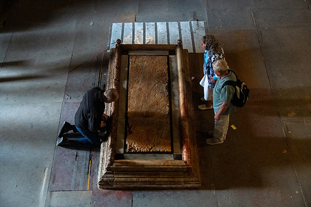 Pilgrims visit the Church of Holy Sepulchre, in the Old city of Jerusalem, Israel.