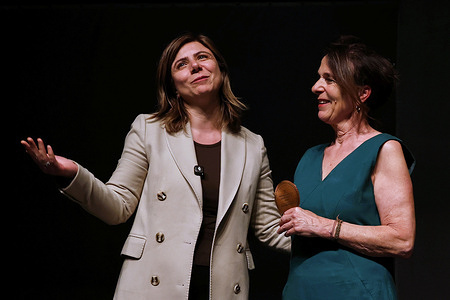 Diyarbakir Metropolitan Municipality Co-Mayor Serra Bucak (L) congratulated the author and director of the play "Brave Women," Anina Jendreyko, by presenting her with a plaque after the performance. The play "Brave Women," written and directed by Swiss actress and director Anina Jendreyko, was staged at the 11th Amed International Theatre Festival in Diyarbakir, Turkey. In the play, five theater actors tell the stories of famous women in history who stood against injustice and oppression, accompanied by songs and dance.