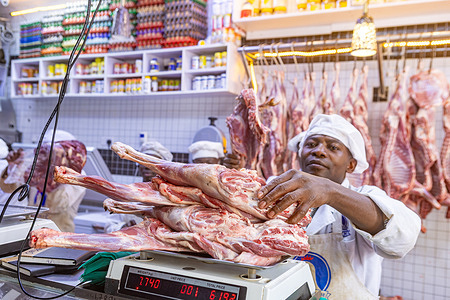 A butcher attendant in Eastleigh weighs goat meat (chevon) for sale to customers in Nairobi during Eid al-Fitr celebrations marking the end of Ramadan. Muslims across Nairobi celebrate Eid al-Fitr with prayers, charity, and celebrations, gathering at mosques and open grounds across the city. The day was filled with joy, reflection, and community as families shared meals and gave to those in need.