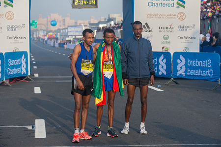 The Standard Chartered Dubai Marathon 2018 men's winners stand for pictures after the race.