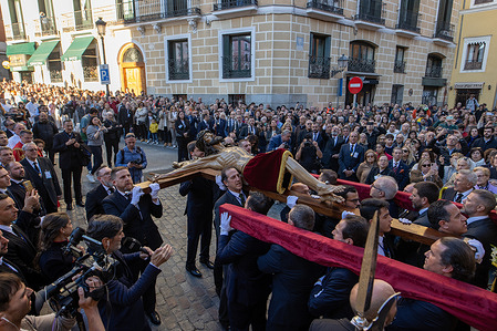 Members of the brotherhood carry an image of Christ during a Holy Tuesday procession in Madrid. The image of Christ of the Halberdiers will be transferred to the Royal Palace on Holy Tuesday, marking the start of preparations for the procession through the streets of Madrid on Good Friday, organized by the Congregation of the Holy Christ of Faith, Christ of the Halberdiers, and Mary Immaculate Queen of the Angels.
