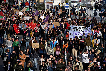 Protesters march through the streets holding placards and banners during the demonstration. Thousands of people demonstrated on the streets of Marseille on the occasion of International Women's Rights Day.