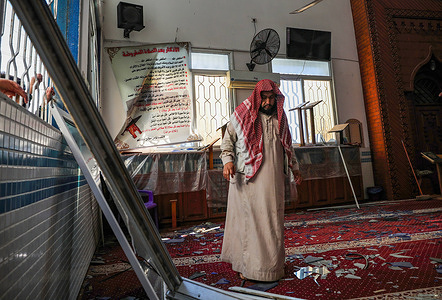 A Palestinian man inspects a damaged mosque following Israeli airstrikes.Israel reportedly attacked after Palestinian militants fired rockets at Israel, in the east of Gaza city, the Israeli army said that three Hamas targets, including a rocket manufacturing site, underground infrastructure, and a military post were targeted after a rocket was fired from Gaza Strip.