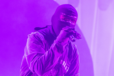 Danish anonymous mask-wearing rapper and singer D1MA performs live on the Orange Stage at Roskilde Festival 2025. The festival is the largest of its kind in the Nordics with an expected 130,000 participants during the 7 days of the festival spans. The camping area opened four days before the festival. The headline acts include Olivia Rodrigo, Charli XCX, Fontaines D.C. and MØ.