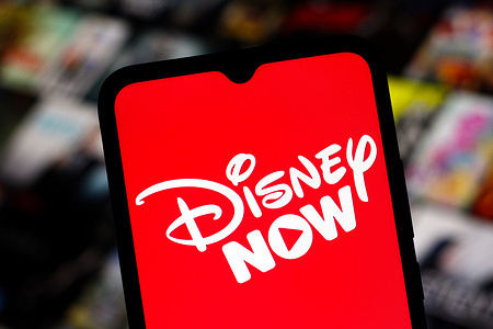 In this photo illustration, the DisneyNow (Disney Now) logo is seen displayed on a smartphone screen