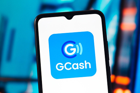 In this photo illustration, the GCash (G Cash) logo is seen displayed on a smartphone screen.