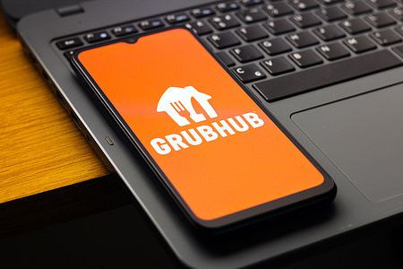 In this photo illustration, the Grubhub logo is seen displayed on a smartphone screen.