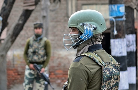 An Indian paramilitary troopers stands alert during curfew in Srinagar. 
Kashmir continued to remain shut for the third consecutive day on Wednesday against the killing of 17 people including 13 militants and 4 civilians in separate encounters in south Kashmir. Reports said that all the business establishments, government and private offices were closed following a call by separatists, while authorities imposed curfew in several areas to stop street protests.