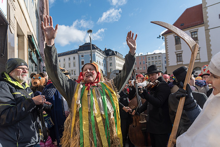 People dressed in traditional costumes attend the local carnival, in Czech language called Masopust, in historical centre of Olomouc. Historical centre of Olomouc, which is located in Moravia region, is part of UNESCO world heritage list. Masopust celebration is organized between Christmas and lent-term. In the traditional meaning Masopust means abandonment of meat. Carnival is organized to celebrate the time period, when eating of meat is allowed between two lent periods.