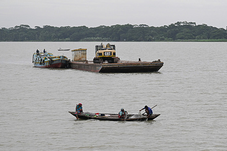 Fishermen are seen fishing in the middle of the Arial Kha River. Life along the Arial Kha River in Barishal flows with the rhythm of fishing boats, floating markets, and daily river commutes. Locals rely on the river for transport, trade, and livelihood, especially fishing, despite seasonal challenges and erosion threats.