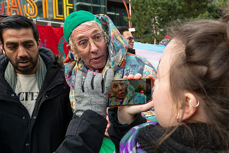 A pro trans protester being interviewed during the demonstration. A counter-protest organised by members of the trade union Unison took place outside The Castle Leisure Centre in London, alongside trans rights activists, as they responded to a women’s protest over the banning of gym user Miranda Newsom from the council-run facility. Unison members and trans rights campaigners demonstrated in support of trans inclusion policies in public services, holding placards and chanting in defence of transgender rights and equality. The counter-demonstration unfolded at the same time as the women’s protest, with police present as opposing groups gathered in separate areas outside the leisure centre, underscoring ongoing national tensions over gender identity, single-sex spaces, and council policy.