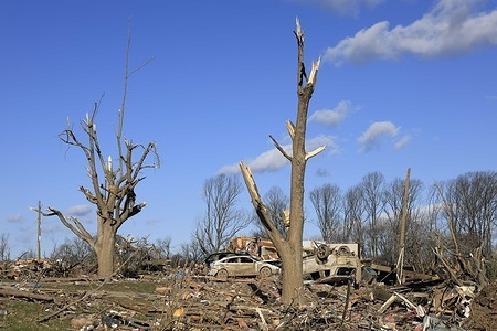 Cars rest in the debris after a tornado in Stinesville, Indiana. A tornado struck the area on March 31, 2023, destroyed houses along the road, and hospitalized some residents with injuries. Two people were killed nearby at McCormick’s Creek State Park when the tornado destroyed a campground.