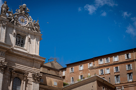 Black smoke billows from the Sistine Chapel chimney where cardinals gather on the second day of the conclave to elect the new Pope in Vatican City.