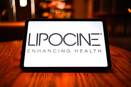 In this photo illustration, the logo of Lipocine is displayed on the screen of a smart tablet.
