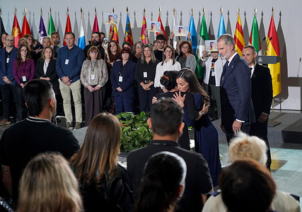 King Felipe VI of Spain is seen watching Queen Letizia hug the flood victim's family member during the National Memorial Ceremony. The National Memorial Ceremony in Valencia on October 29, 2025, marked one year since the devastating 2024 floods. King Felipe VI attended the solemn event, offering condolences and support alongside grieving families. The floods, caused by an extreme weather phenomenon known as a DANA, claimed 237 lives and caused widespread destruction, leaving lasting political and emotional scars in the region.