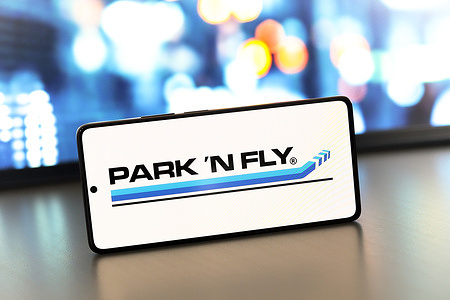 In this photo illustration, the Park 'N Fly logo is displayed on a smartphone screen.
