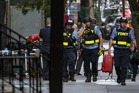 FDNY members in bullet proof vests at the scene of an active shooter at 345 Park Ave in New York City. State and Local law enforcement respond to an active shooter at 345 Park Ave in New York City. A police officer and two civilians were shot.