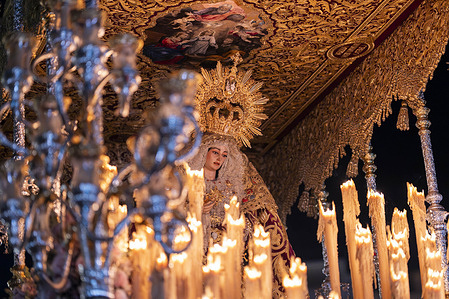 Virgin of the Trinity, sacred statue on her processional throne. Málaga marks the 25th anniversary of the Virgin of the Trinity's coronation with an extraordinary procession. The southern Spanish city of Málaga held an extraordinary religious procession to mark the 25th anniversary of the canonical coronation of the sacred image of 'Trinidad', a revered Marian image venerated by the 'Cautivo' brotherhood.

The image, normally seen only during holy week, was carried through the city’s streets in an extraordinary out-of-season event that drew large crowds of worshippers and visitors. The procession featured traditional music, floral offerings and members of the brotherhood dressed in their ceremonial robes.

The 'Cautivo' brotherhood, founded in the 20th century, is one of Málaga’s most popular religious fraternities.