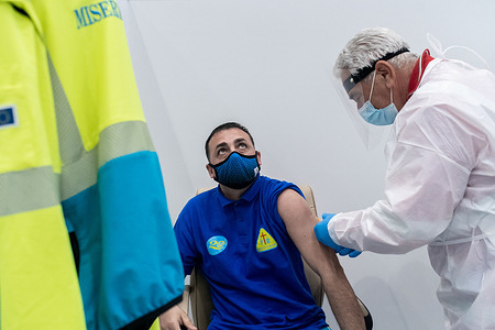 A volunteer of the medical emergency service Misericordia gets the AstraZeneca vaccine during the inauguration.The COVID-19 Vaccine Hub set up at the Trade Fair Centre in Catanzaro Lido, has been inaugurated and is considered the biggest in the region, potentially it may have the capacity to carry out 2,500 vaccinations per day. Several regional and local authorities attended the event and personnel from charitable organizations received the AstraZeneca vaccine.