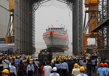 Workers are seen during the launch of second advanced stealth frigate warship of P17A class at Mazagon Dock Shipbuilders Limited (MDL) in Mumbai. The warship 'Udaygiri' was launched by Indian Defence Minister Rajnath Singh who was the chief guest at the event.